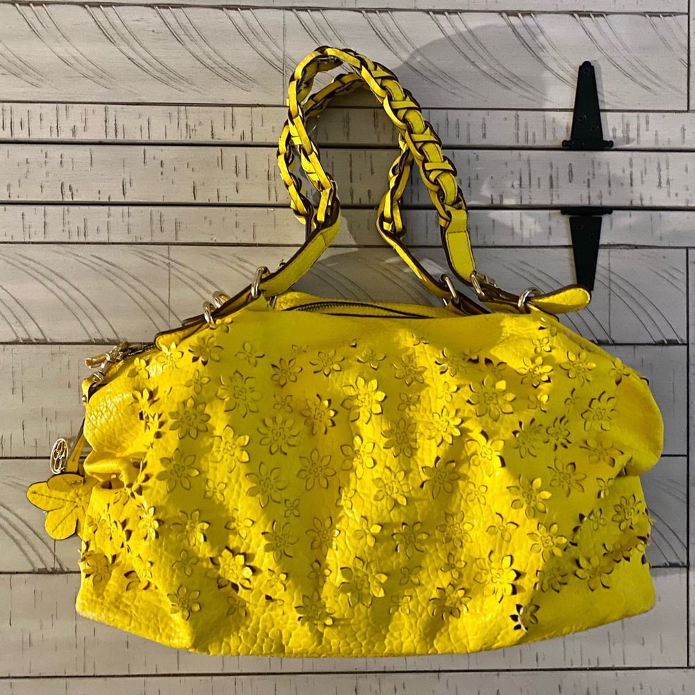 Yellow flower cut out Jessica Simpson purse.